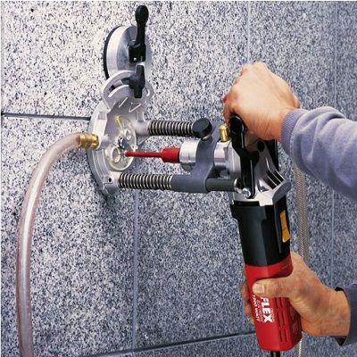 Perceuse portative avec ventouse à clapet